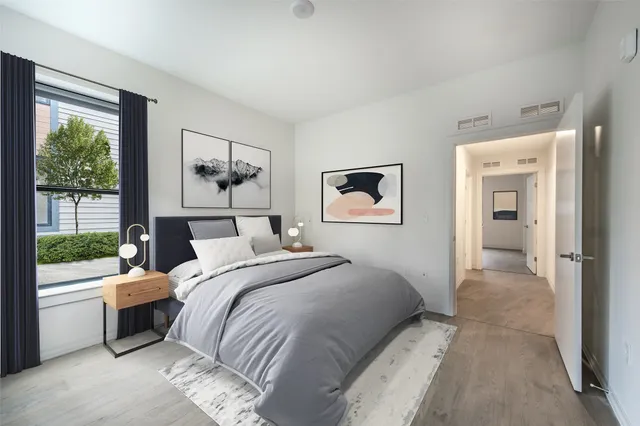 a bedroom with a bed and a view of bathroom