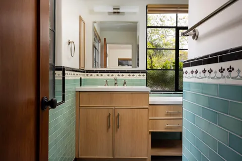 a bathroom with a sink and a mirror
