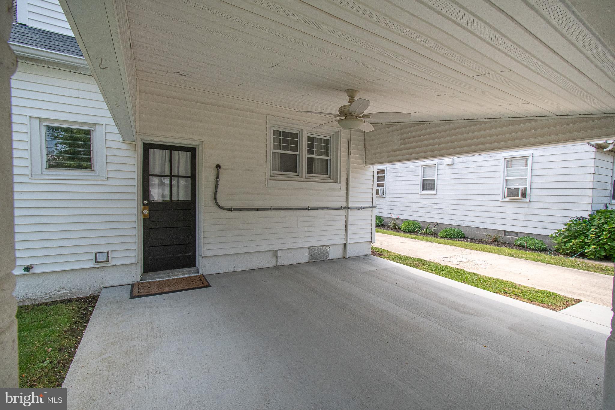 207 Crusader Road Cambridge, MD 21613 - Photo 65 of 76 a view of a house with a backyard and porch