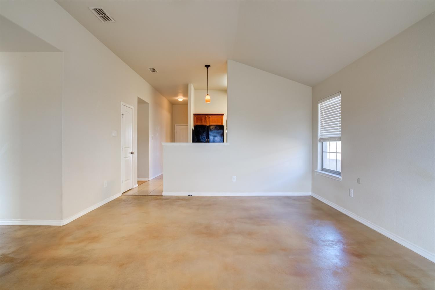 6921 95th Street Lubbock, TX 79424 - Photo 9 of 32 a view of an empty room with a window