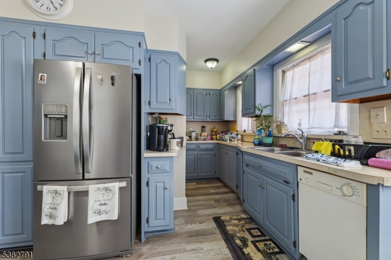 57 Greenwood Avenue Madison, NJ 07940 - Photo 12 of 30 a kitchen with stainless steel appliances a refrigerator sink and cabinets