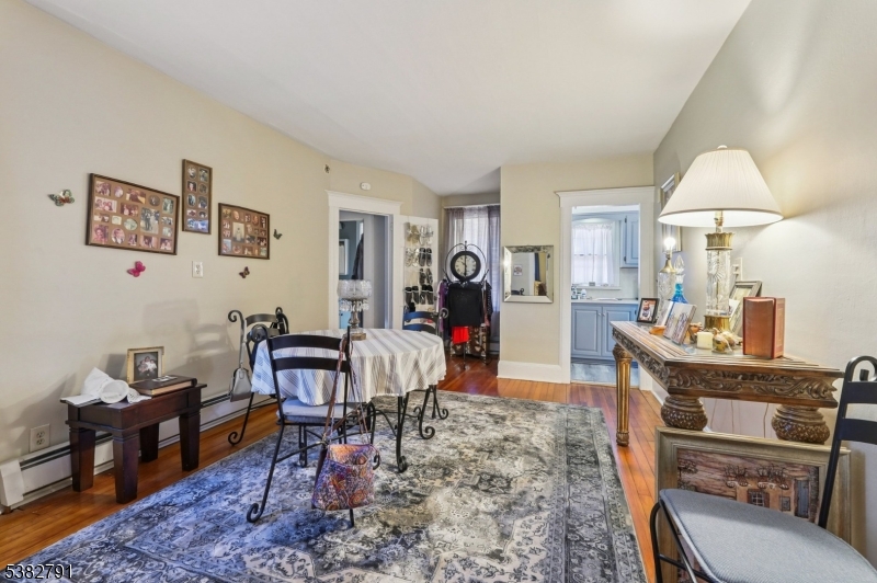 57 Greenwood Avenue Madison, NJ 07940 - Photo 14 of 30 a living room with furniture a rug and a lamp
