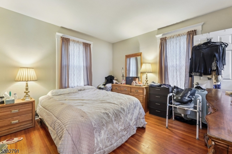 57 Greenwood Avenue Madison, NJ 07940 - Photo 15 of 30 a bed room with a bed and a tv