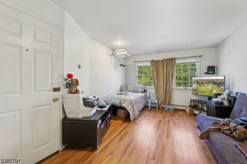 57 Greenwood Avenue Madison, NJ 07940 - Photo 21 of 30 a living room with furniture and a wooden floor