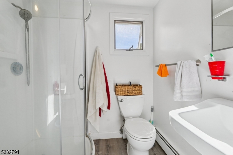 57 Greenwood Avenue Madison, NJ 07940 - Photo 25 of 30 a white toilet sitting next to a bathroom sink