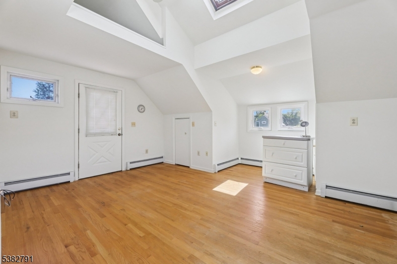 57 Greenwood Avenue Madison, NJ 07940 - Photo 28 of 30 a view of an empty room with wooden floor