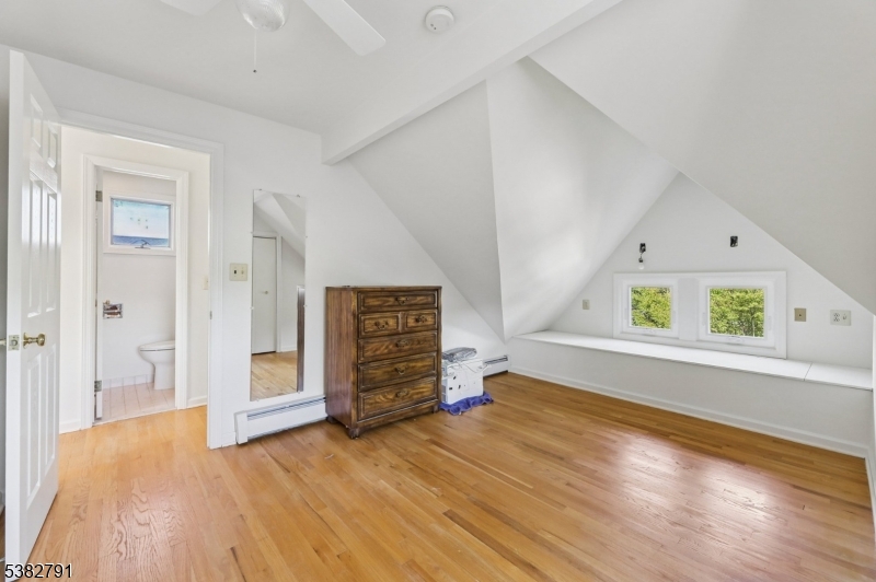 57 Greenwood Avenue Madison, NJ 07940 - Photo 29 of 30 wooden floor in an empty room with a window
