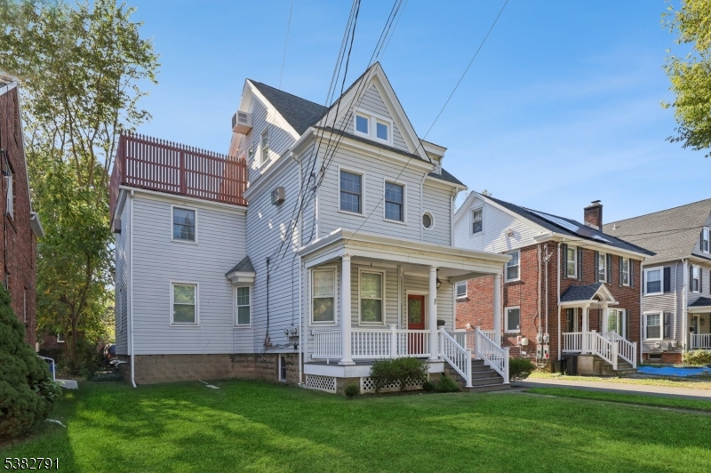 57 Greenwood Avenue Madison, NJ 07940 - Photo 3 of 30 front view of a house with a yard