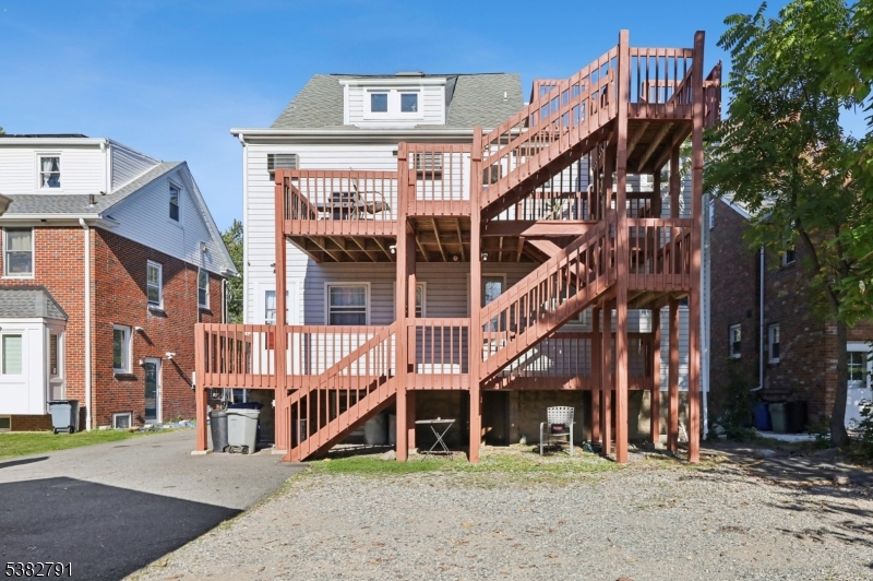 57 Greenwood Avenue Madison, NJ 07940 - Photo 4 of 30 a front view of a building with a garden