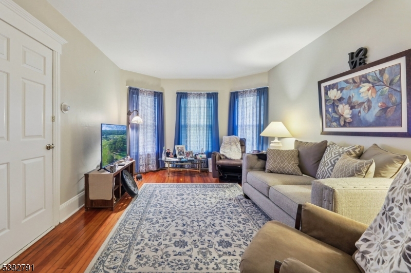 57 Greenwood Avenue Madison, NJ 07940 - Photo 8 of 30 a living room with furniture and a couch
