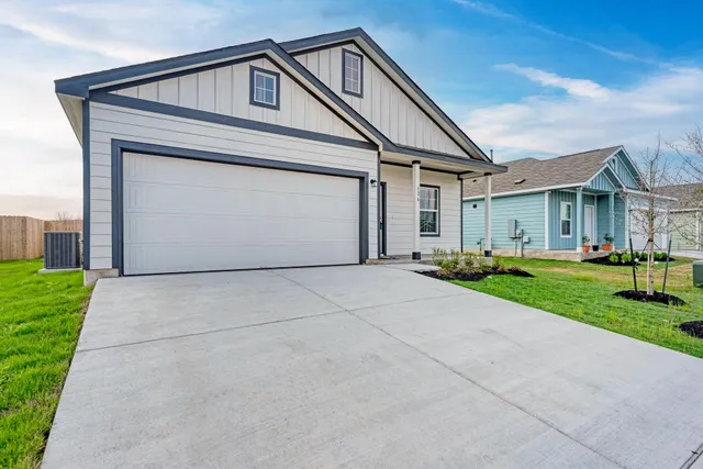 a kitchen with stainless steel appliances a sink stove and cabinets