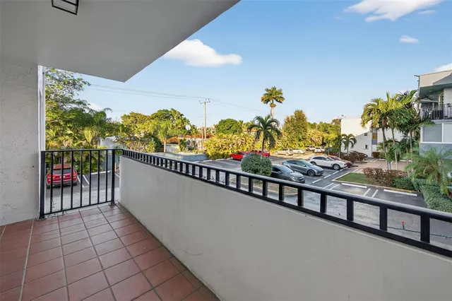 a view of a house with backyard and a car