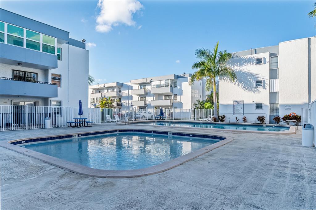 2465 Southwest 18th Avenue, Unit 3206 Miami, FL 33133 - Photo 17 of 21 a view of a swimming pool and a chair