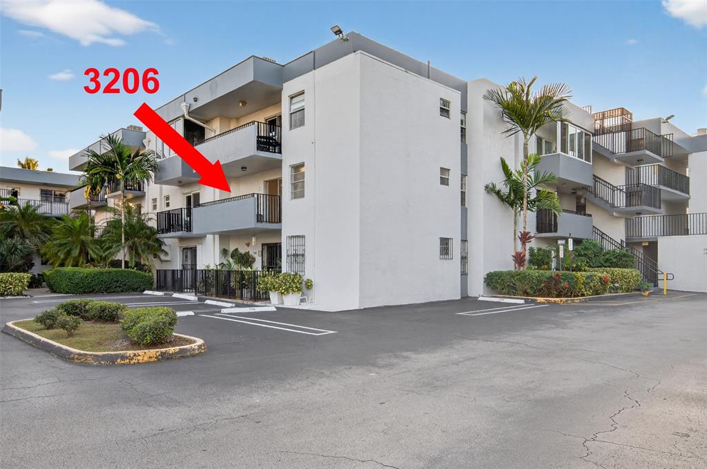 2465 Southwest 18th Avenue, Unit 3206 Miami, FL 33133 - Photo 2 of 21 a view of a house with backyard and a car