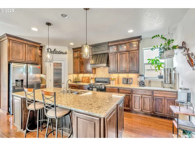 a kitchen with a table chairs stove and cabinets