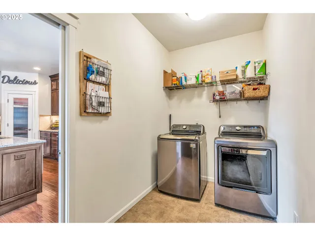 a kitchen with stainless steel appliances granite countertop a stove and a sink
