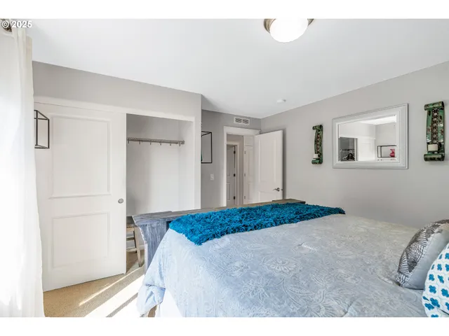 a bedroom with a bed and a cabinets
