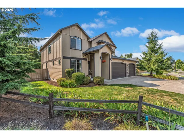 a front view of a house with garden