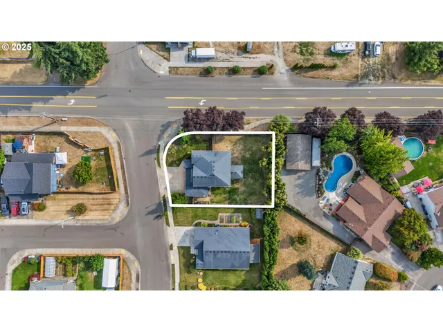 an aerial view of houses with outdoor space