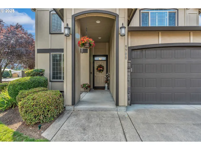 a view of front door of house and car parked