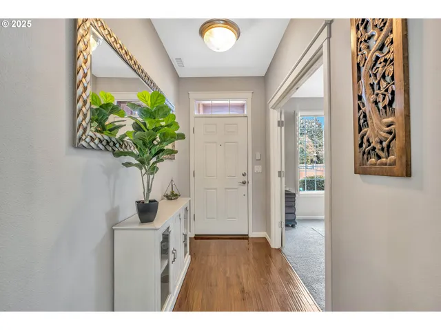 a view of entryway with wooden floor