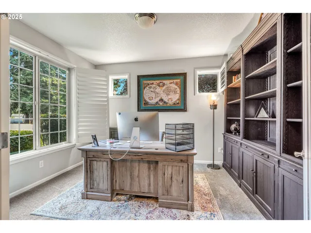 a view of kitchen with cabinets