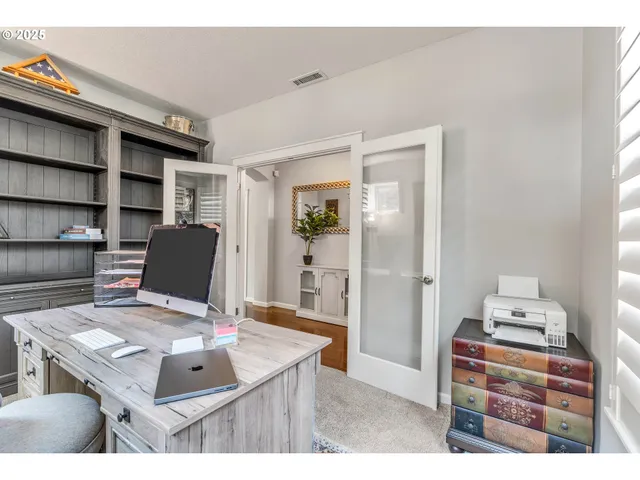 a room with furniture and a wooden floor