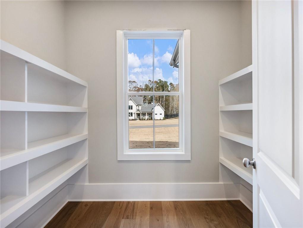 216 Ewing Way Dacula, GA 30019 - Photo 21 of 56 a view of a room with rack on the wall and a window