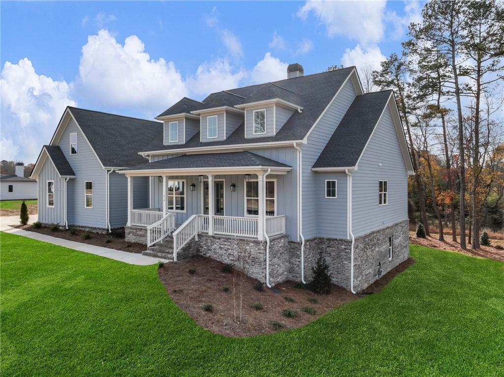 216 Ewing Way Dacula, GA 30019 - Photo 3 of 56 a view of a house with a yard and sitting area