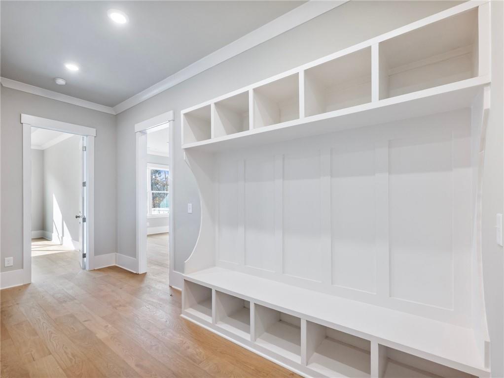 216 Ewing Way Dacula, GA 30019 - Photo 34 of 56 a view of an empty room with wooden floor and a window