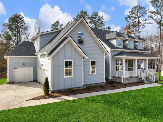 a view of a yard in front view of a house