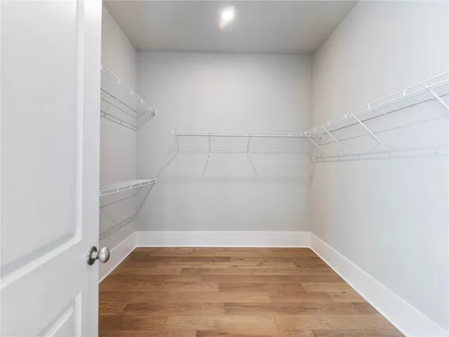 a view of a balcony with wooden floor