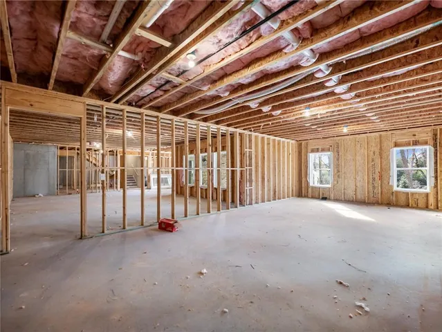 a view of a chair and table of the back yard of the house