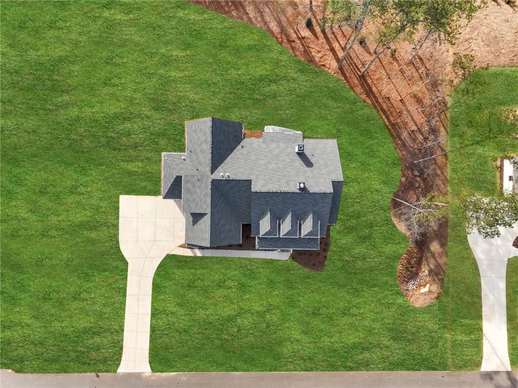 216 Ewing Way Dacula, GA 30019 - Photo 56 of 56 a view of a chair and table of the back yard of the house