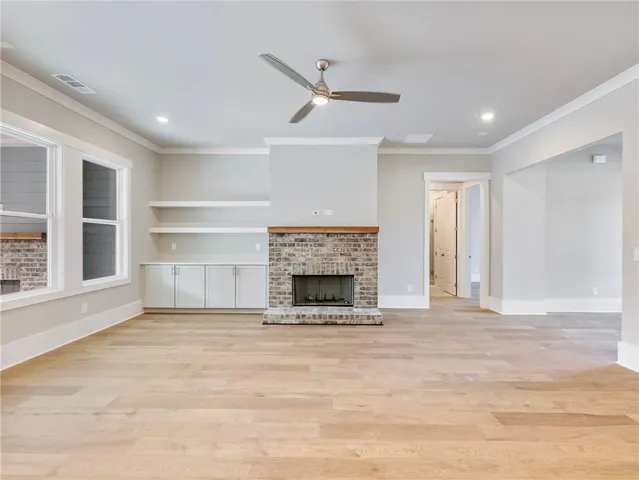 a view of kitchen with kitchen island and stainless steel appliances