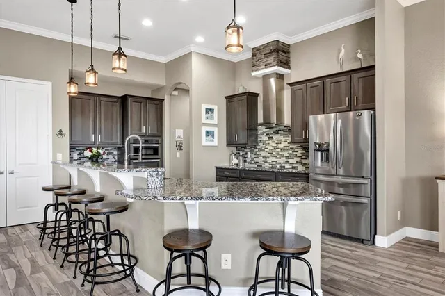 a lobby with furniture and potted plants