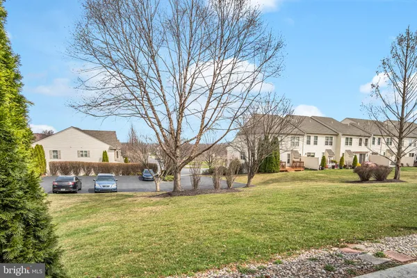a front view of a house with a yard table and chairs