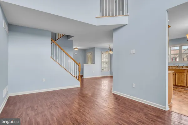 a view of an entryway with wooden floor