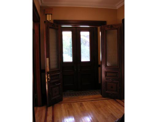 82 Herrick Road Newton, MA 02459 - Photo 3 of 12 a view of a hallway with wooden floor and a bathroom