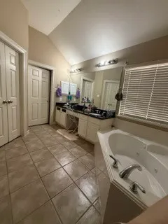 a kitchen with a sink appliances and cabinets