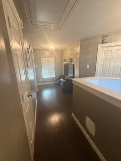 a view of hall way with furniture