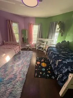 a living room with furniture rug and a large window