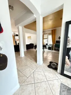 a view of a hallway to closet and a rug