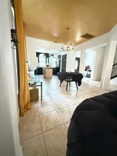 a living room with furniture and a table