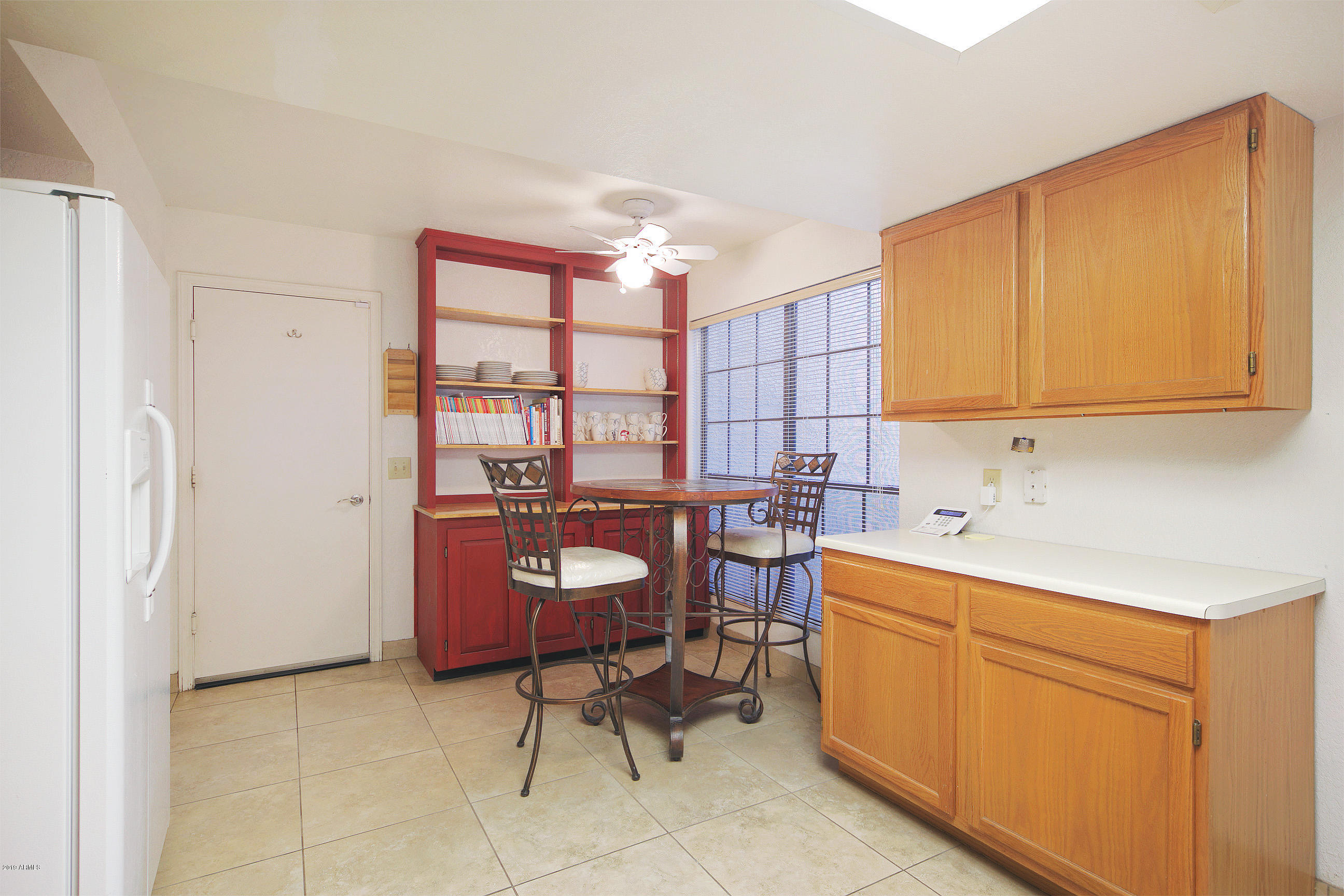 4217 East Agave Road Phoenix, AZ 85044 - Photo 10 of 20 a view of a kitchen with a sink and cabinets
