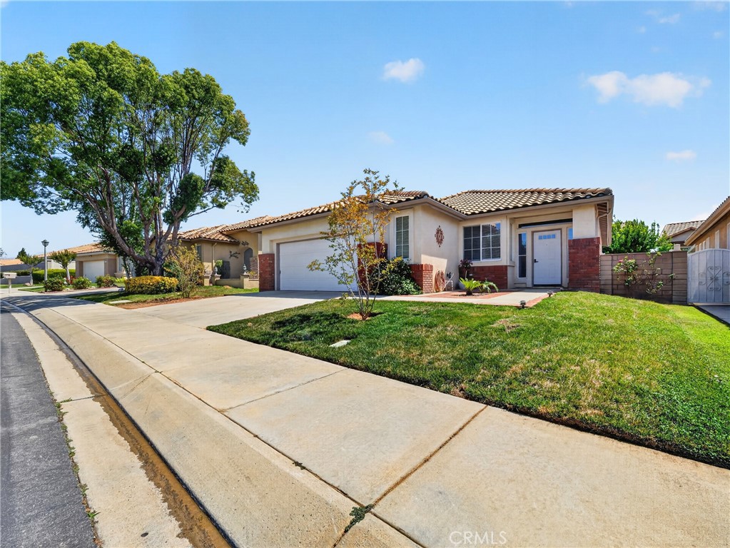 1436 Riviera Avenue Banning, CA 92220 - Photo 3 of 43 a front view of house with yard and green space