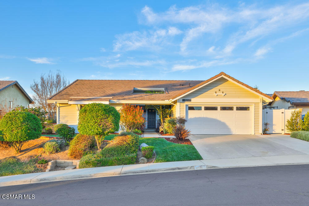 13777 Gunsmoke Road Moorpark, CA 93021 - Photo 1 of 42 a front view of a house with a yard and garage