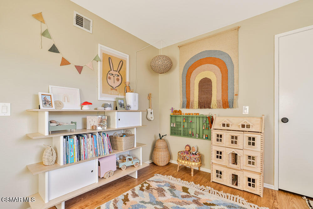 13777 Gunsmoke Road Moorpark, CA 93021 - Photo 20 of 42 a bedroom with furniture and a book shelf