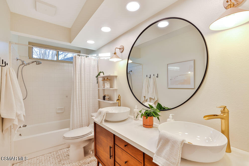 13777 Gunsmoke Road Moorpark, CA 93021 - Photo 21 of 42 a bathroom with a sink a toilet and a mirror