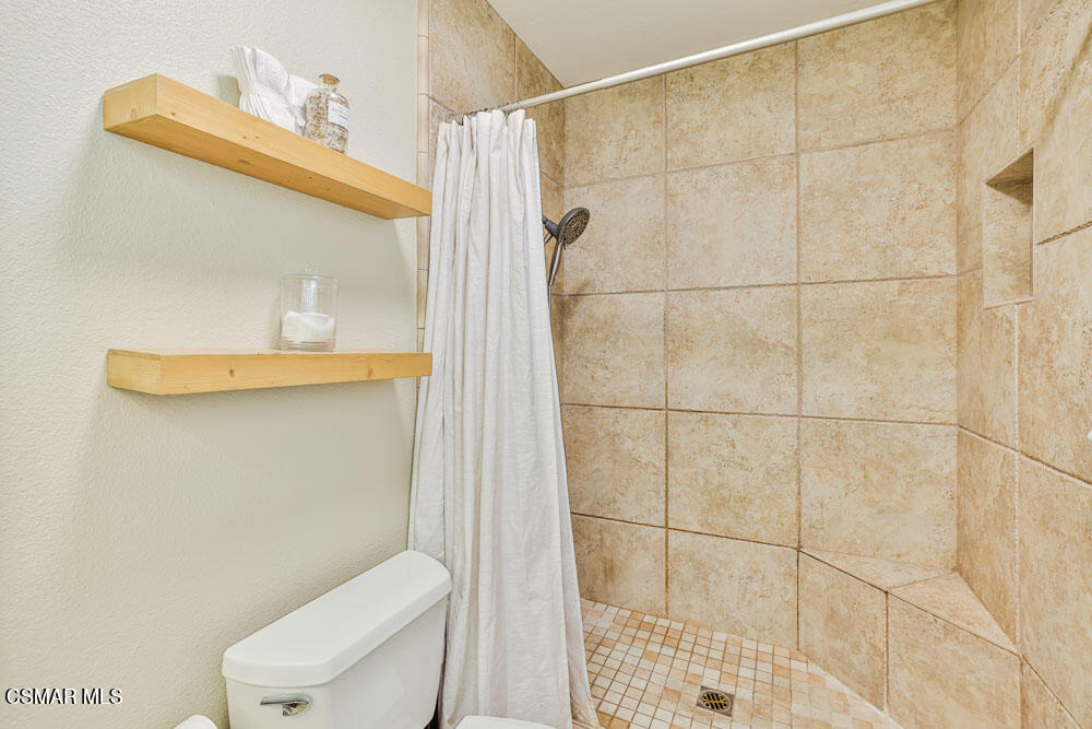 13777 Gunsmoke Road Moorpark, CA 93021 - Photo 26 of 42 a white toilet sitting next to a bathroom sink